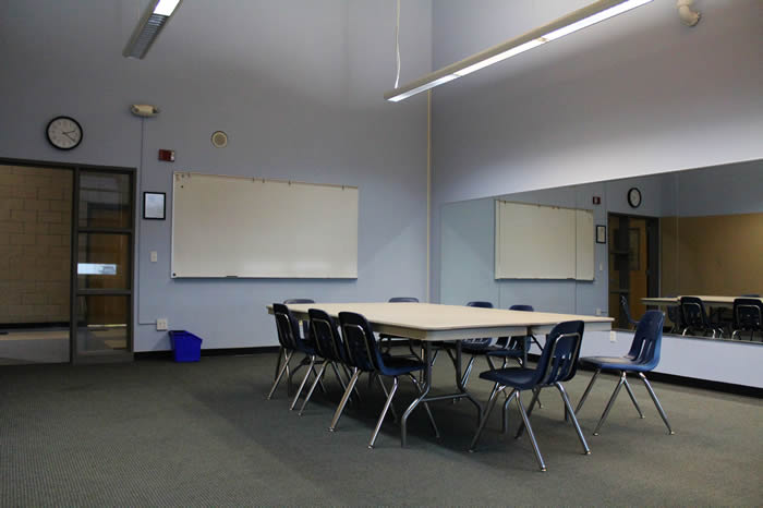 small meeting room with mirrored wall