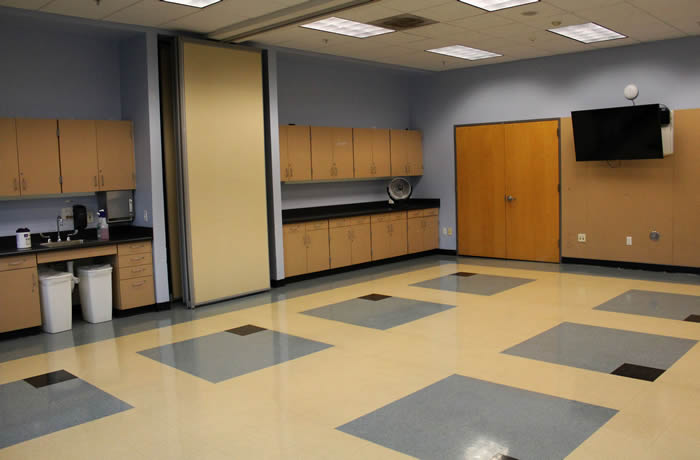 classroom with sink and tv