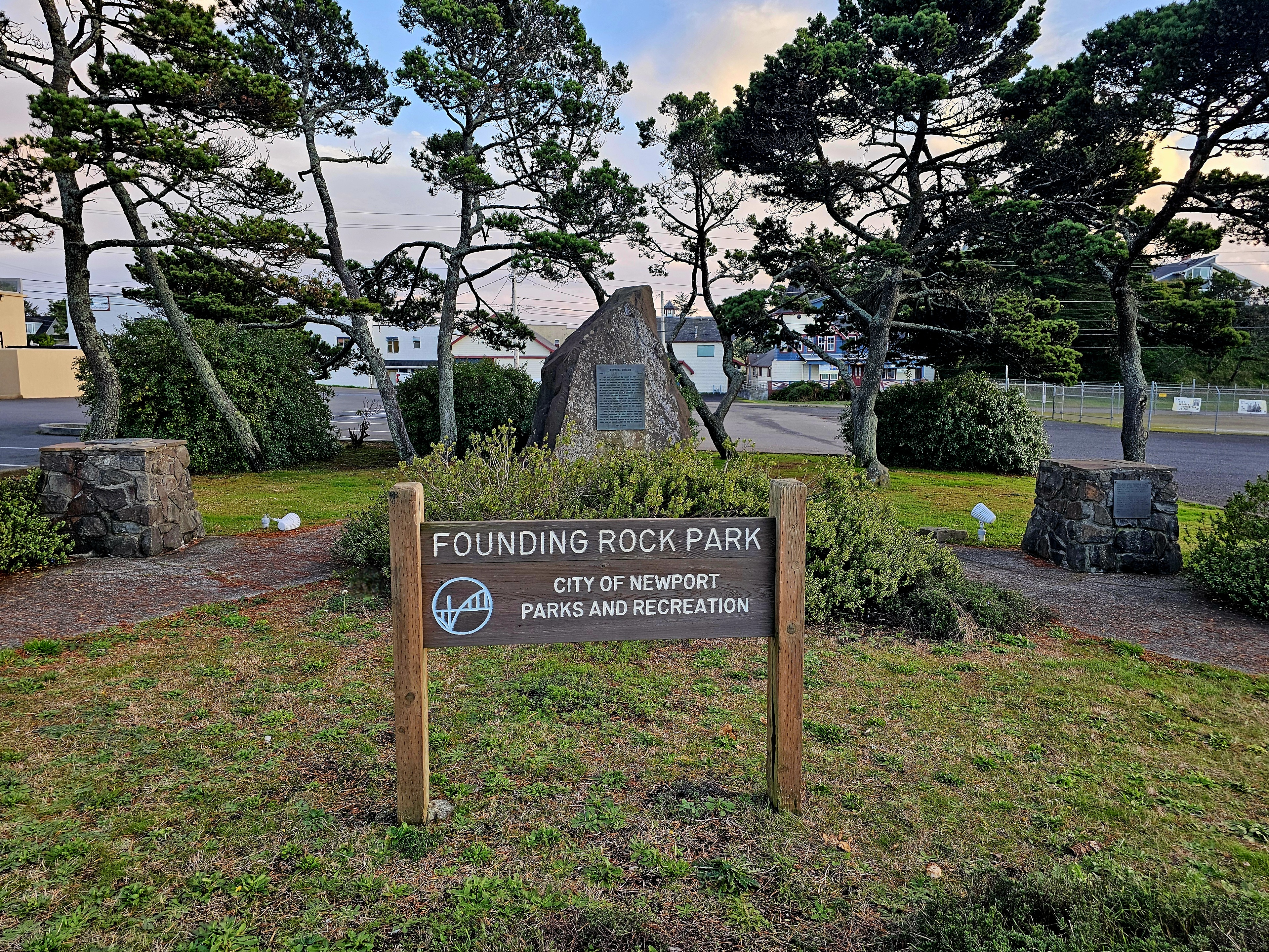 park sign with rock in background